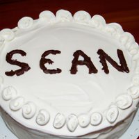 A birthday cake with the words SEANC written in icing (1).jpg